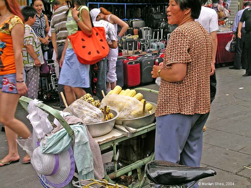 selling corn from a small push cart