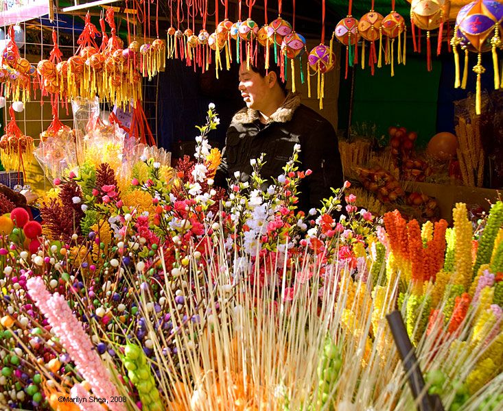 Artifical flowers in a booth