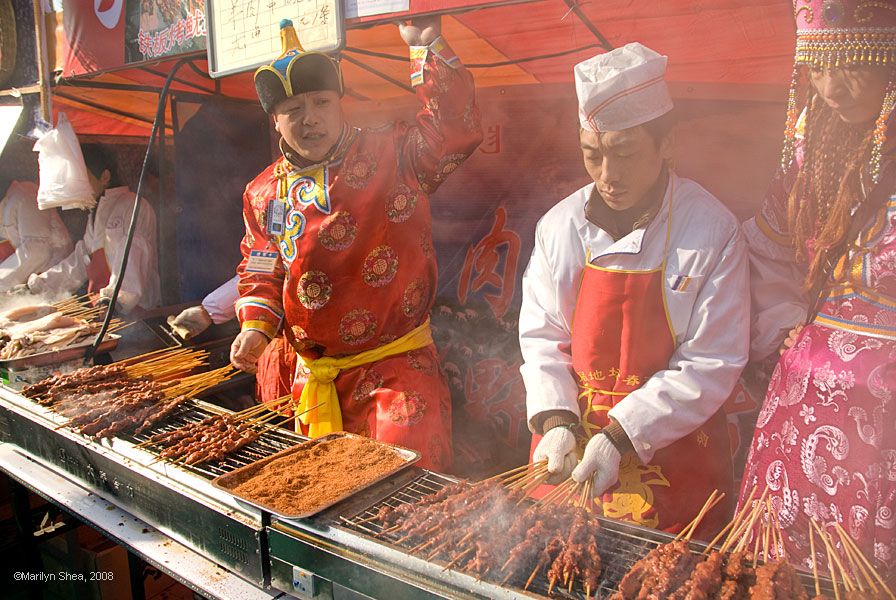 Vendor in Qing Dynasty costume selling barbeque