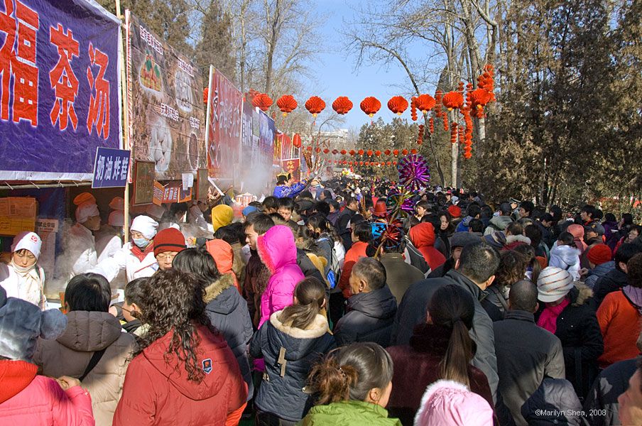 long line of food vendors with people five deep