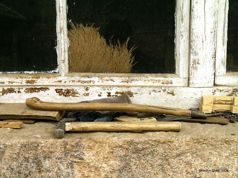 Hammer and axe on the ledge of the farmouse