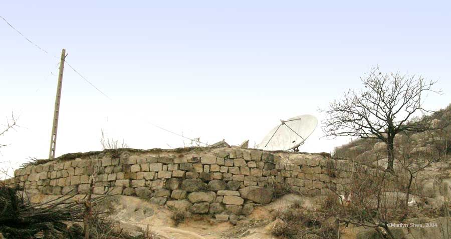 Large satelite dish on top of the hill