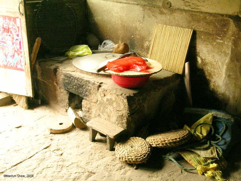 Stone kitchen stove with whole in the bottom to place wood on the fire