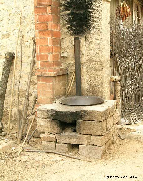 Stone barbeque with wok set into the stone