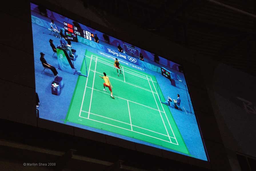 Projection monitor view of Chen Jin in men's singles badminton