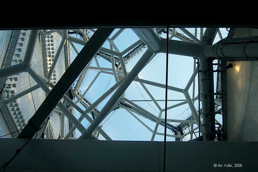 looking up at the sky through the water cube