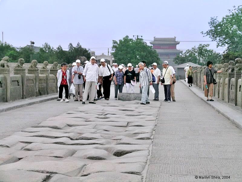 Tour group visits Lugou Qiao, Marco Polo Bridge