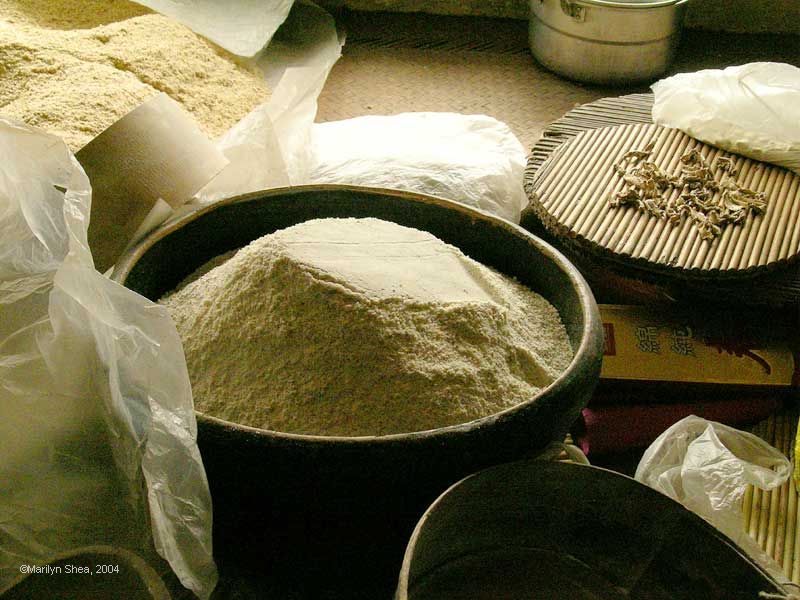 Finely ground corn in a wooden bowl