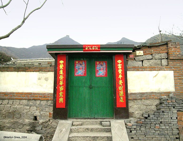 One of the new houses in the village with Spring Festival couplets on the door jams
