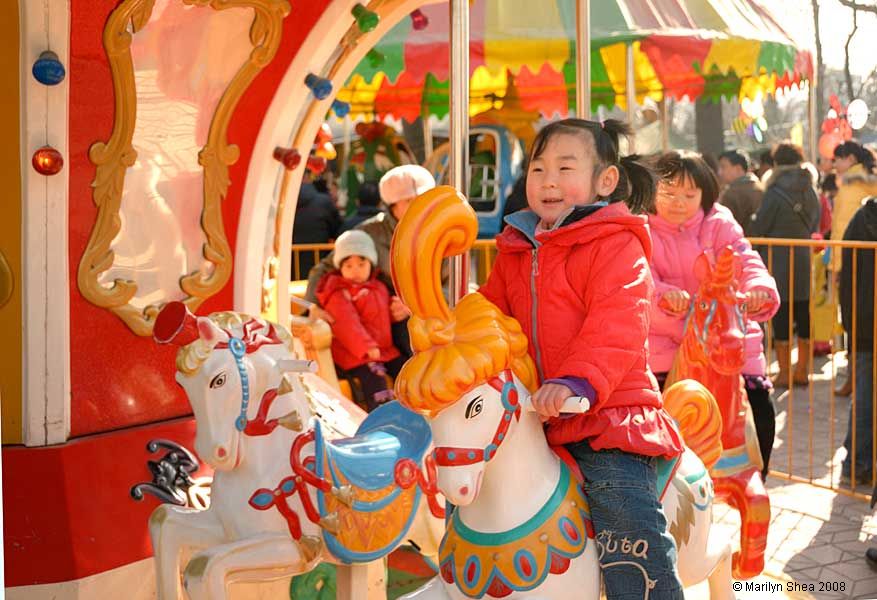 child on merry-go-round